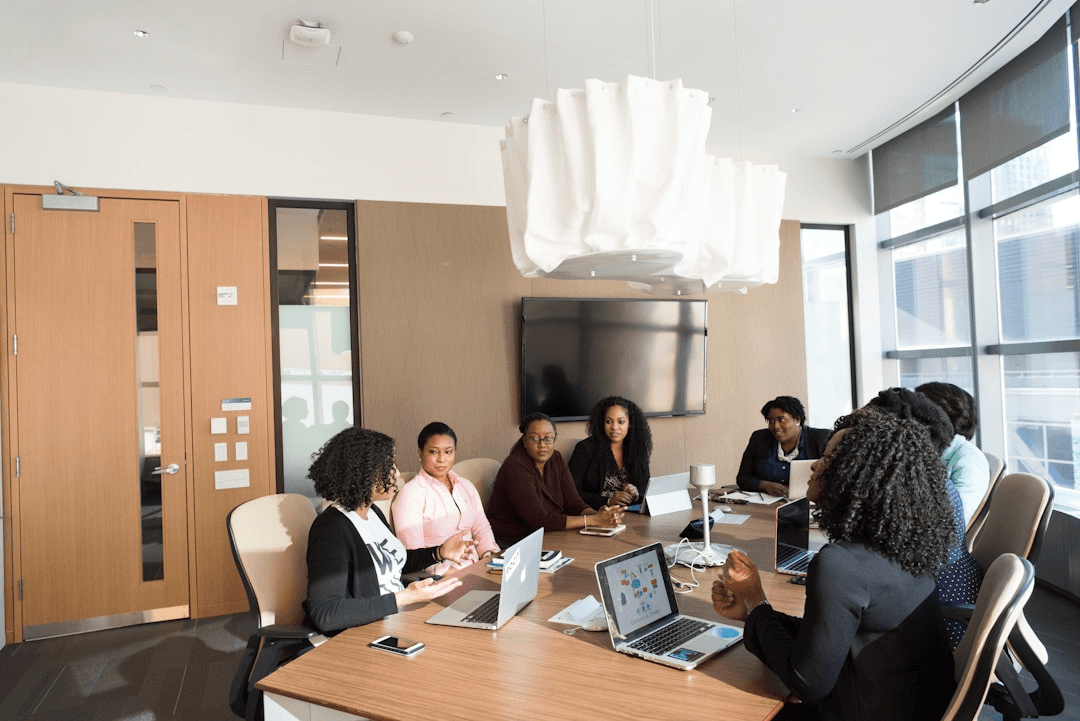 Team gathered in a meeting room preparing company plans